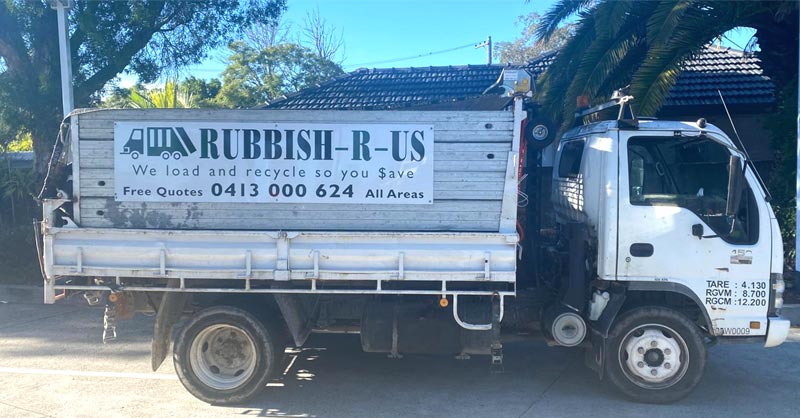 Rubbish R Us crew loading waste onto truck in Sydney